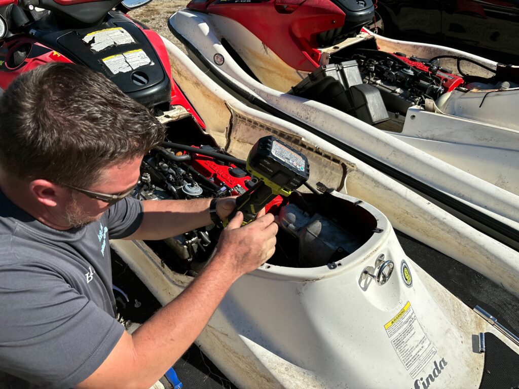 Avi-Ski Technician working on jet ski